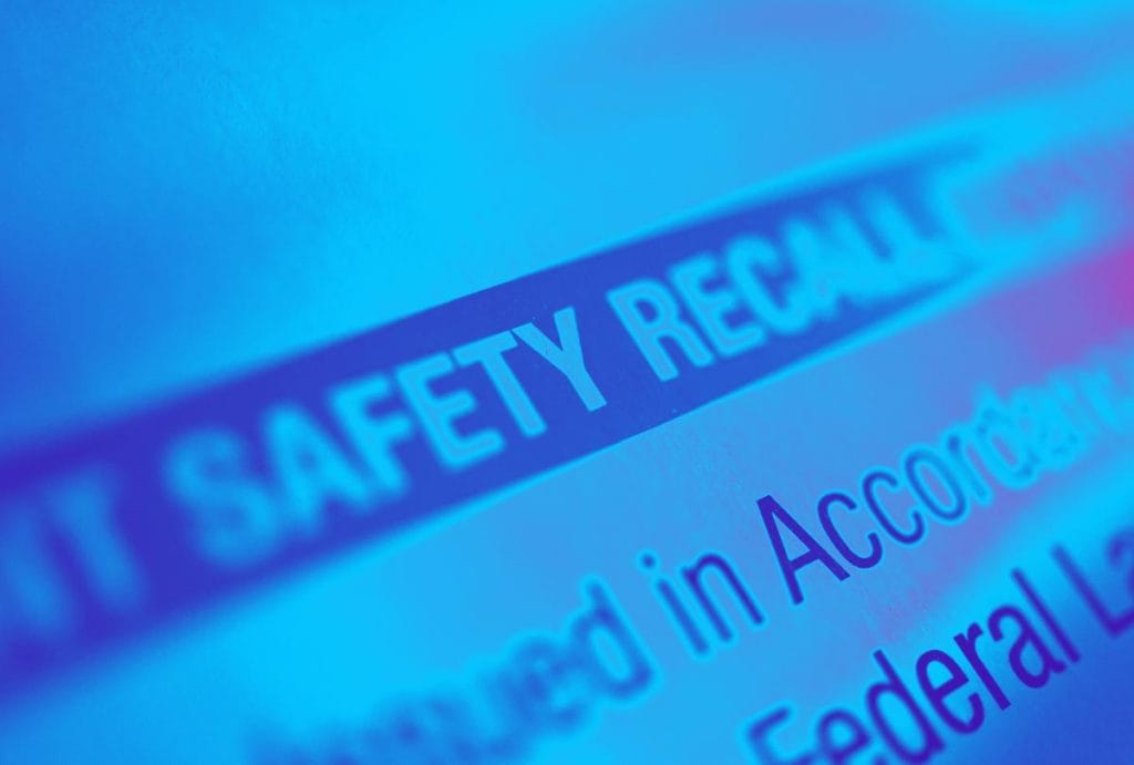 A closeup of the words "safety recall" tinted blue is not an actual image of children's product safety recalls in europe