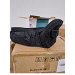 Image shows a black hip seat placed onto a cardboard box. 