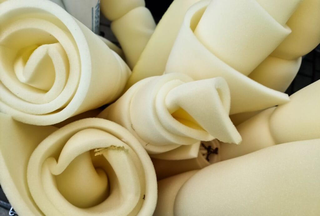 Rolled sheets of foam padding show a common source of PFAS in baby carriers and slings